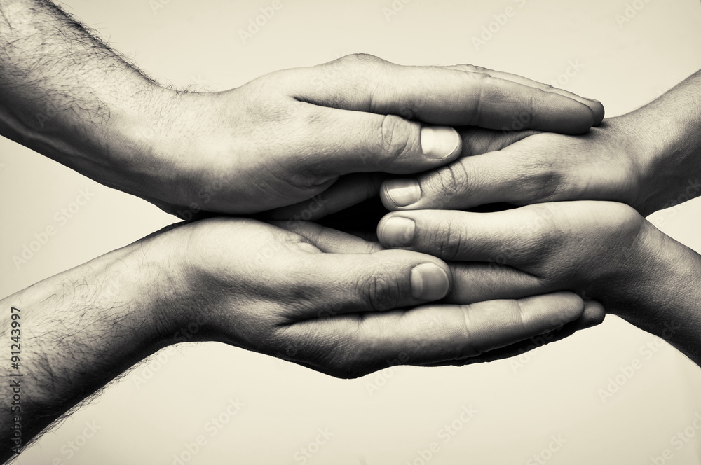 Fototapeta premium Black and white toned photo with hands (hands that take care)
