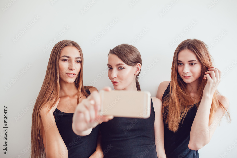 Beautiful Young Girls Taking a Selfie Photo with Phone Beautiful Young Girls Taking a Selfie Photo with Phone