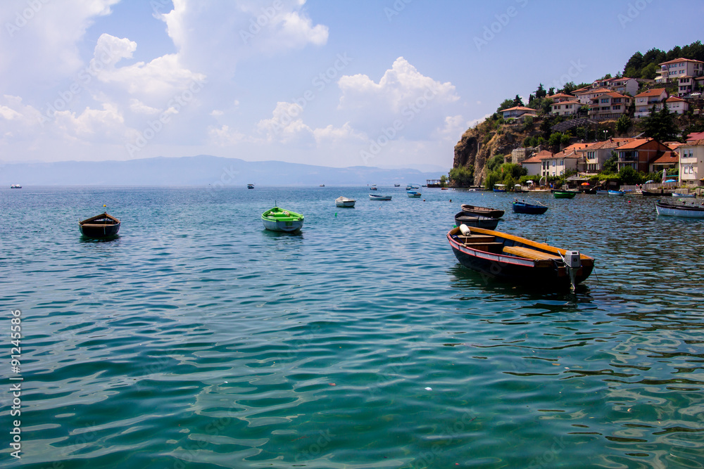 Fishing boats with the view of the old town of Ohrid in the background.