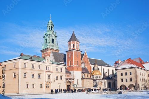 :Tourists in the territory of the Wawel castle. Wawel - the hill and an architectural complex in Krakow, on the left coast of Vistula.