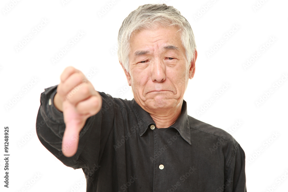 senior Japanese man with thumbs down gesture senior Japanese man with thumbs down gesture