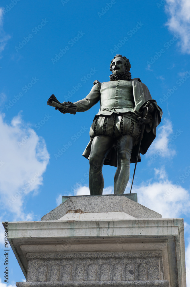 Obraz premium Statue of Miguel de Cervantes - Spanish novelist, poet, and playwright on Plaza de las Cortes in Madrid, Spain