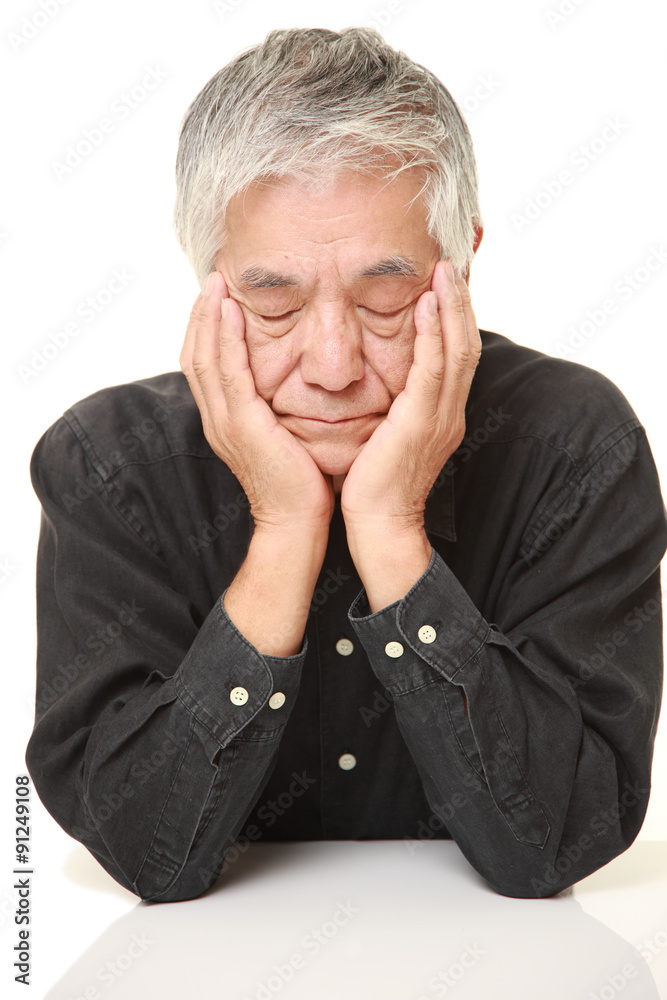 senior Japanese man sleeping on the table senior Japanese man sleeping on the table