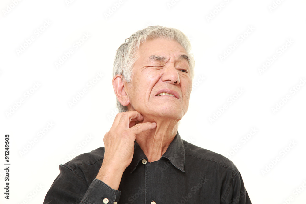 senior Japanese man scratching his neck senior Japanese man scratching his neck