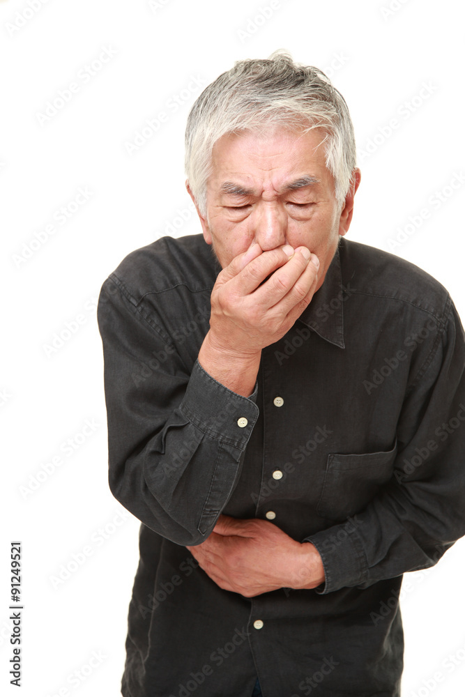 senior Japanese man holding his nose because of a bad smell senior Japanese man holding his nose because of a bad smell