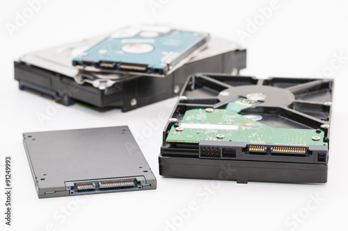 Hard disk next to ssd disk (solid state drive) photo