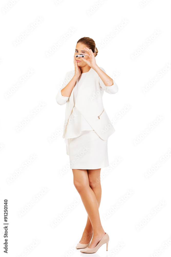 Young businesswoman holding a toy car Young businesswoman holding a toy car