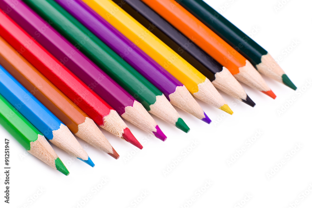 Many different colored pencils on white background