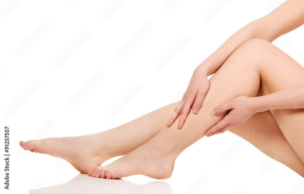 Woman massaging her legs.