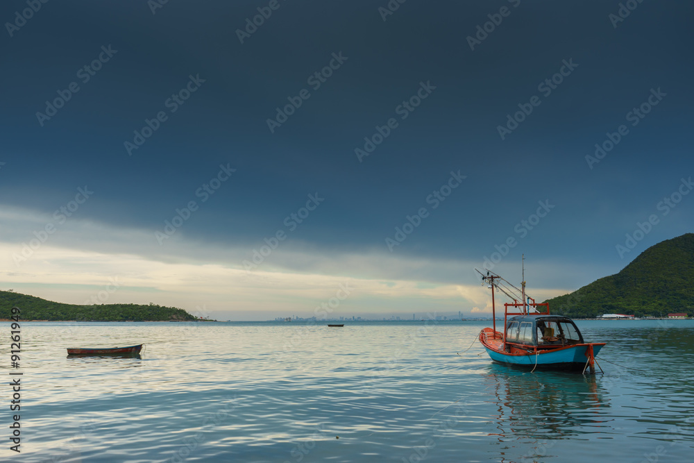 Boats floating on the sea in fishing village Boats floating on the sea in fishing village