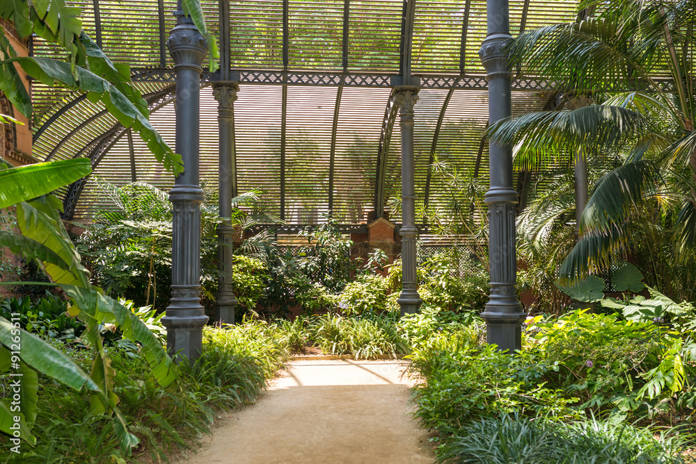 Fototapeta premium Tropical greenhouse, the Umbracle is a wood brick construction for tropical plants in the Citadel Park Barcelona. The Parc de la Ciutadella is situated in the Barcelona district Ciutat Vella