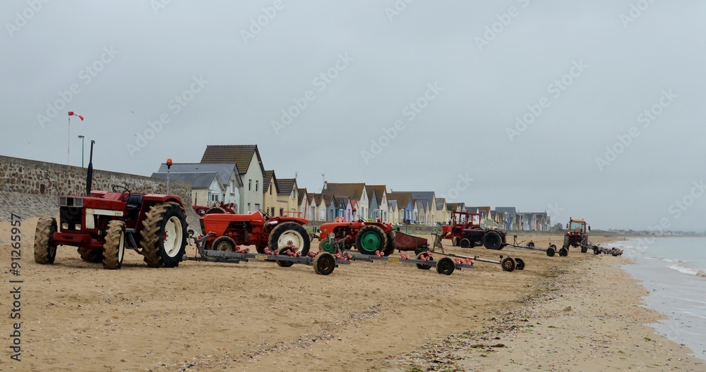 Fototapeta premium tracteurs sur la plage