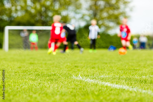 Blurred kids playing soccer match © Mikkel Bigandt