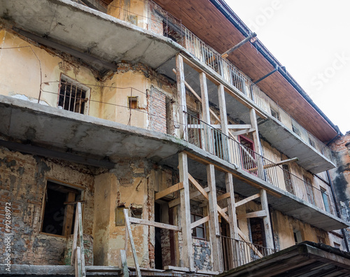 Construction work on the renovation of an old building without doors and windows in Lviv