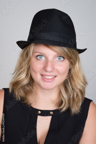 Beautiful young woman wearing summer fedora straw hat © OceanProd