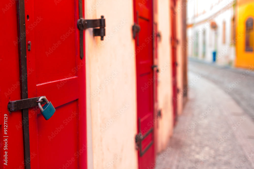 Red wooden door with lock