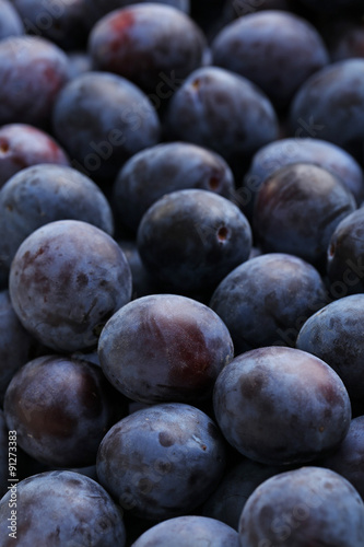 Fresh plums background, close up