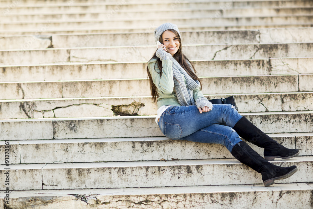 Young woman sitting on the stairs outdoor Young woman sitting on the stairs outdoor