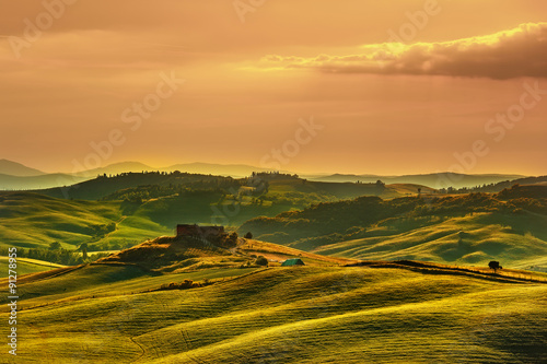 Tuscany spring, rolling hills on sunset. Volterra rural landscap