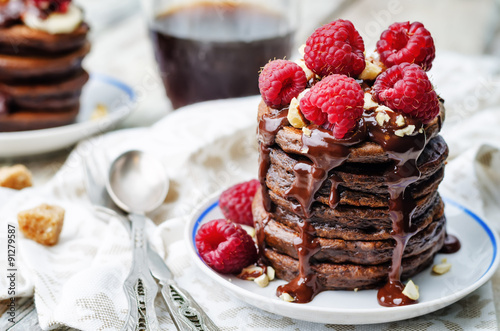 chocolate pancake with bananas, raspberries, nuts and chocolate
