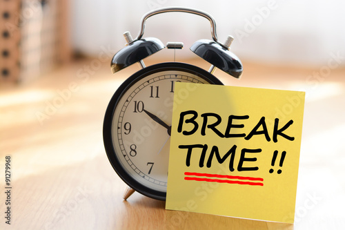 Break time concept with classic alarm clock photo