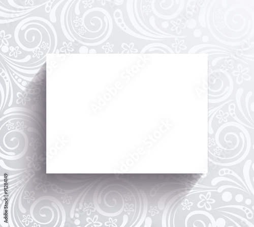 White banner on the wall with floral pattern.