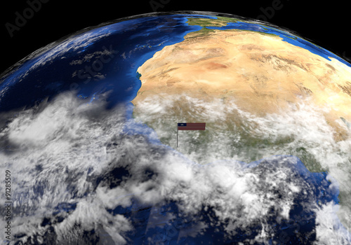 Fototapeta Naklejka Na Ścianę i Meble -  Liberia flag on pole on earth globe illustration - Elements of this image furnished by NASA