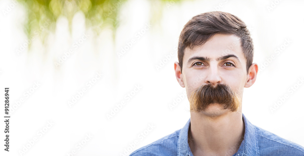 Young man with fake mustaches. Dental health concept. - obrazy, fototapety, plakaty 