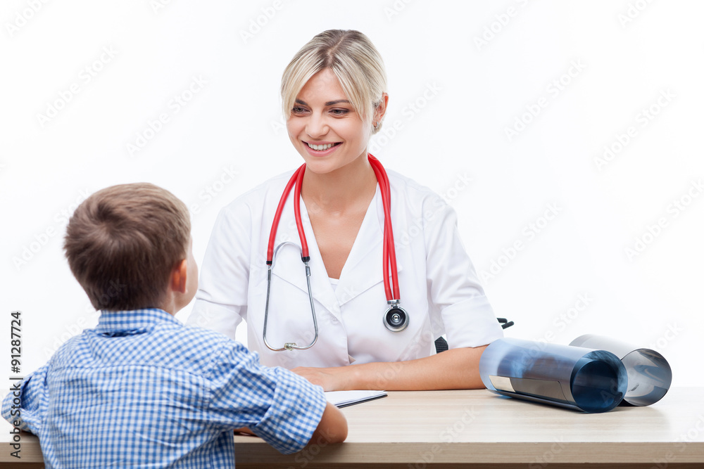 Cheerful young female pediatrician is serving her patient Cheerful young female pediatrician is serving her patient