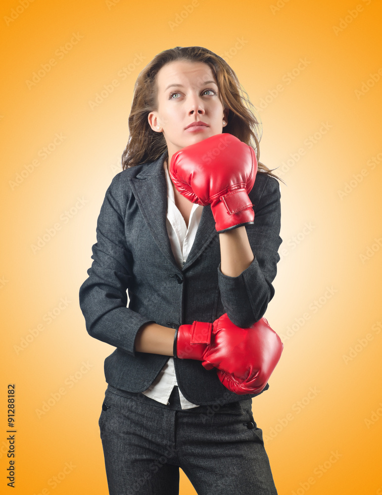 Young businesswoman in boxing concept Young businesswoman in boxing concept