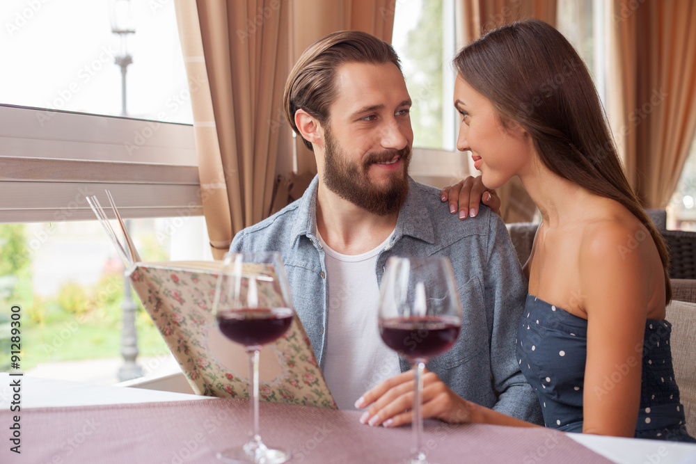 Beautiful young man and woman are resting in cafe Beautiful young man and woman are resting in cafe