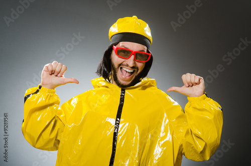 Man wearing yellow suit in funny concept