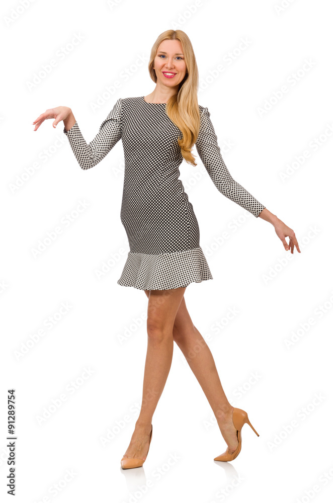 Blond girl in polka dot dress isolated on white