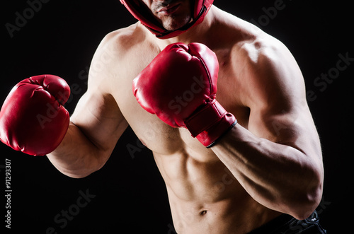 Muscular man in boxing concept