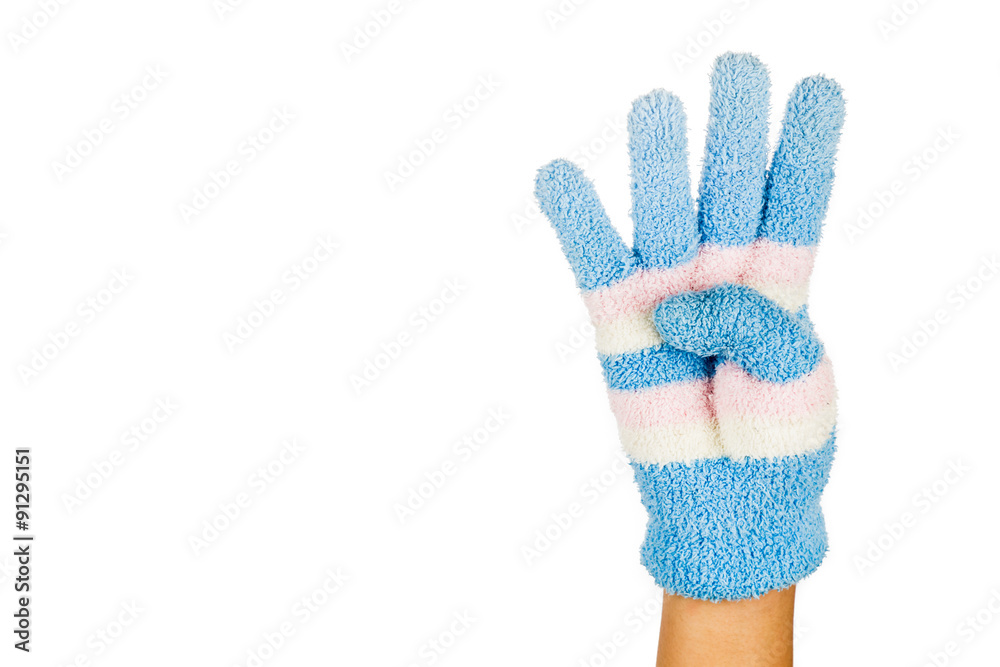 Hand in blue winter glove gesture number four against white background Hand in blue winter glove gesture number four against white background