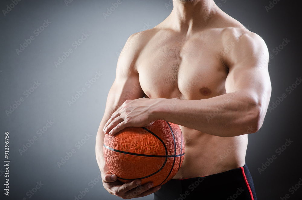 Muscular basketball in sports concept Muscular basketball in sports concept