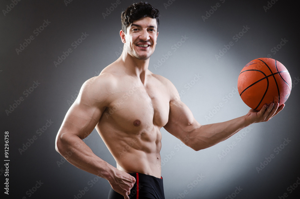 Muscular basketball in sports concept Muscular basketball in sports concept