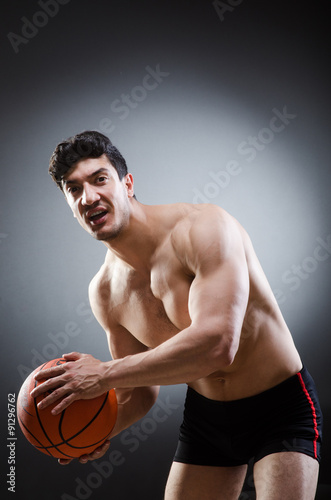 Muscular basketball in sports concept