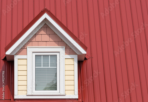 Dormer window on red roof