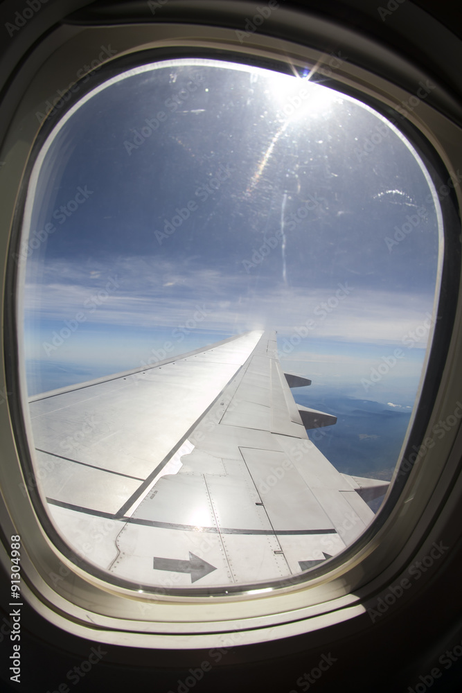 View of wing of an airplane flying View of wing of an airplane flying