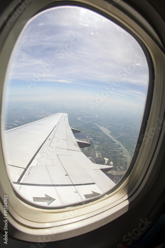 View of wing of an airplane flying