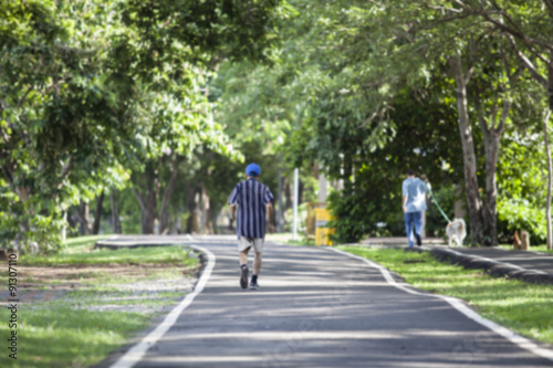 Wallpaper Mural Blur image of man walking in the park Torontodigital.ca