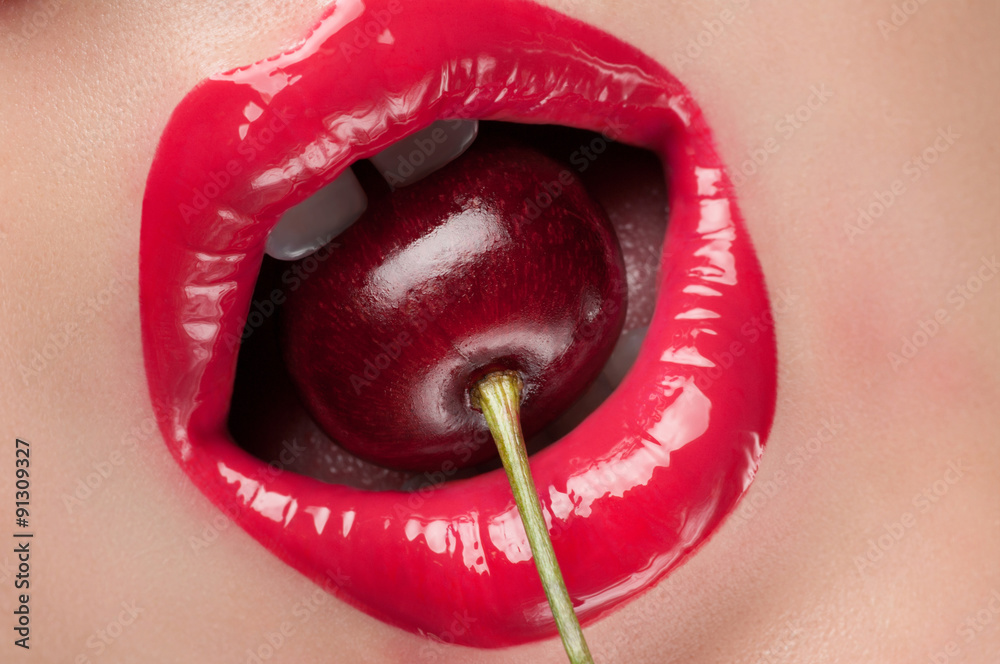 Fototapeta Red lips with a cherry.