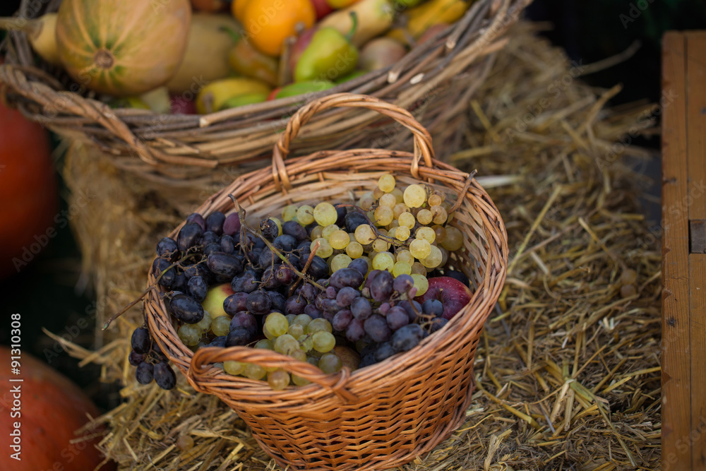 Colorful grape in basket with apples Colorful grape in basket with apples
