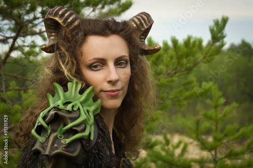 Fotografie Portrait of the pretty female faun in a wood