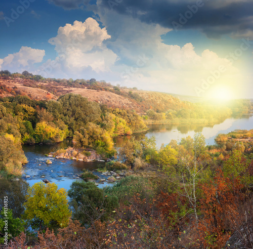 Valley of River in Autumn, beautiful sunny day, colorful trees