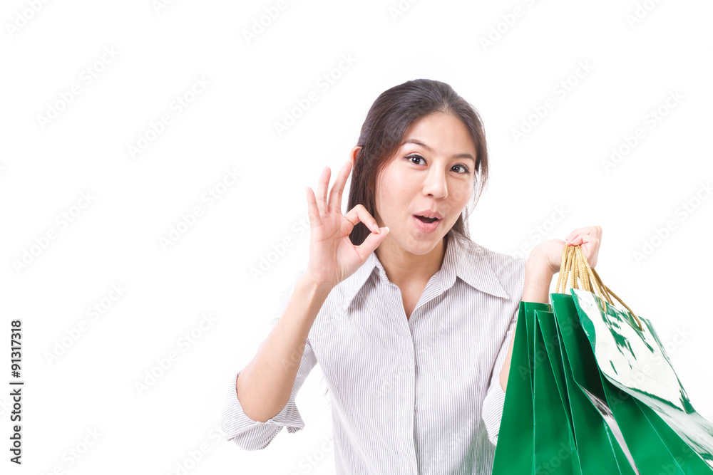 shopping woman showing thumb up gesture