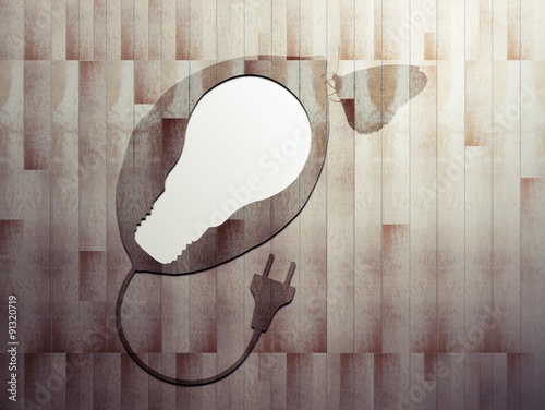 Leaf wood cut light bulb on wood board background, Ecology concept