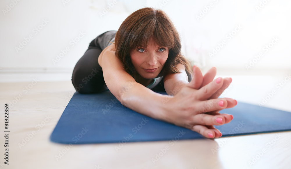 Fitness trainer doing yoga at gym Fitness trainer doing yoga at gym