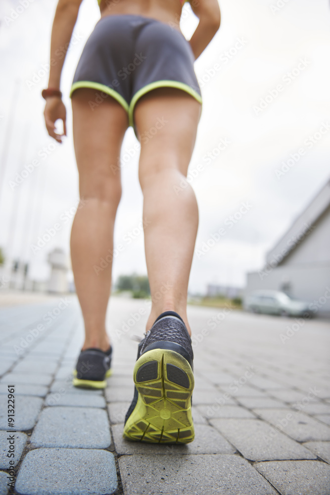 Low section of running woman Low section of running woman